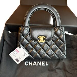 Chanel Black Quilted 
Mini Kelly Shopper